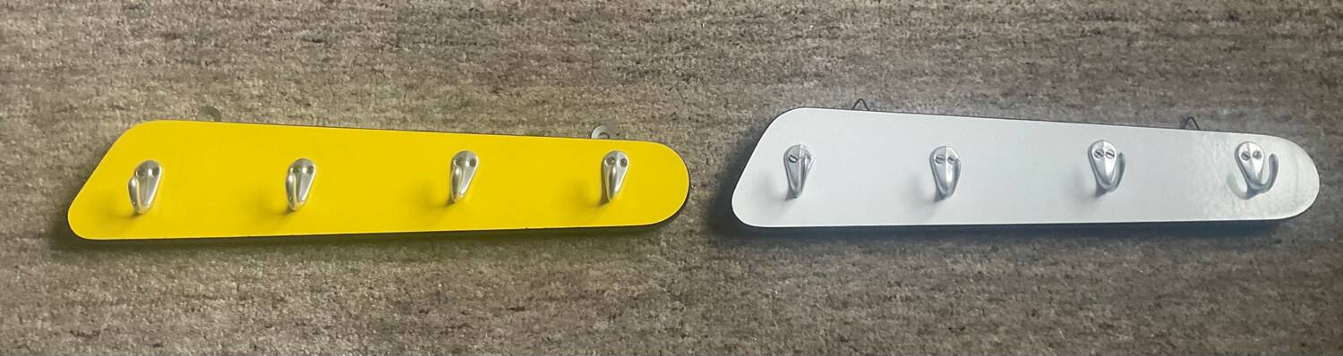 Duo of asymmetrical Formica coat racks from the 60s