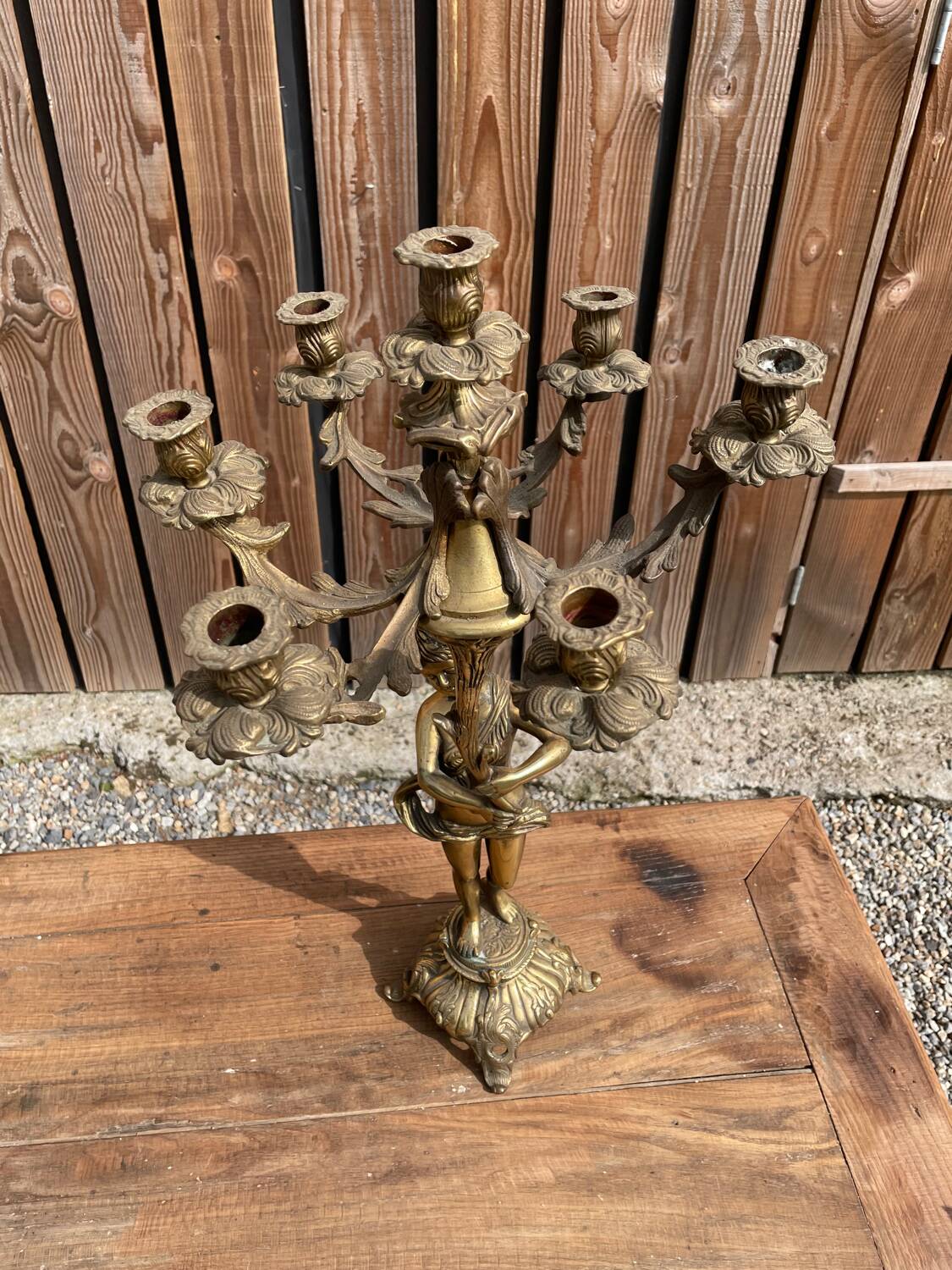 Large bronze candle holder with putti angel