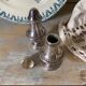 Silver-plated salt and pepper shakers, fluted, beaded decoration.