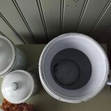 Old enamelled metal jug with gold trim.