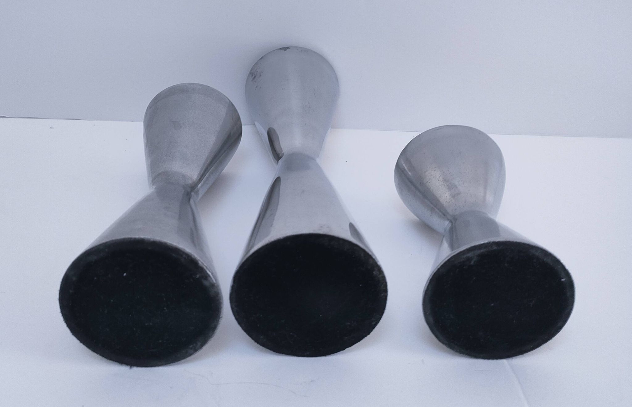 three "diabolo" aluminium design candle holders 90