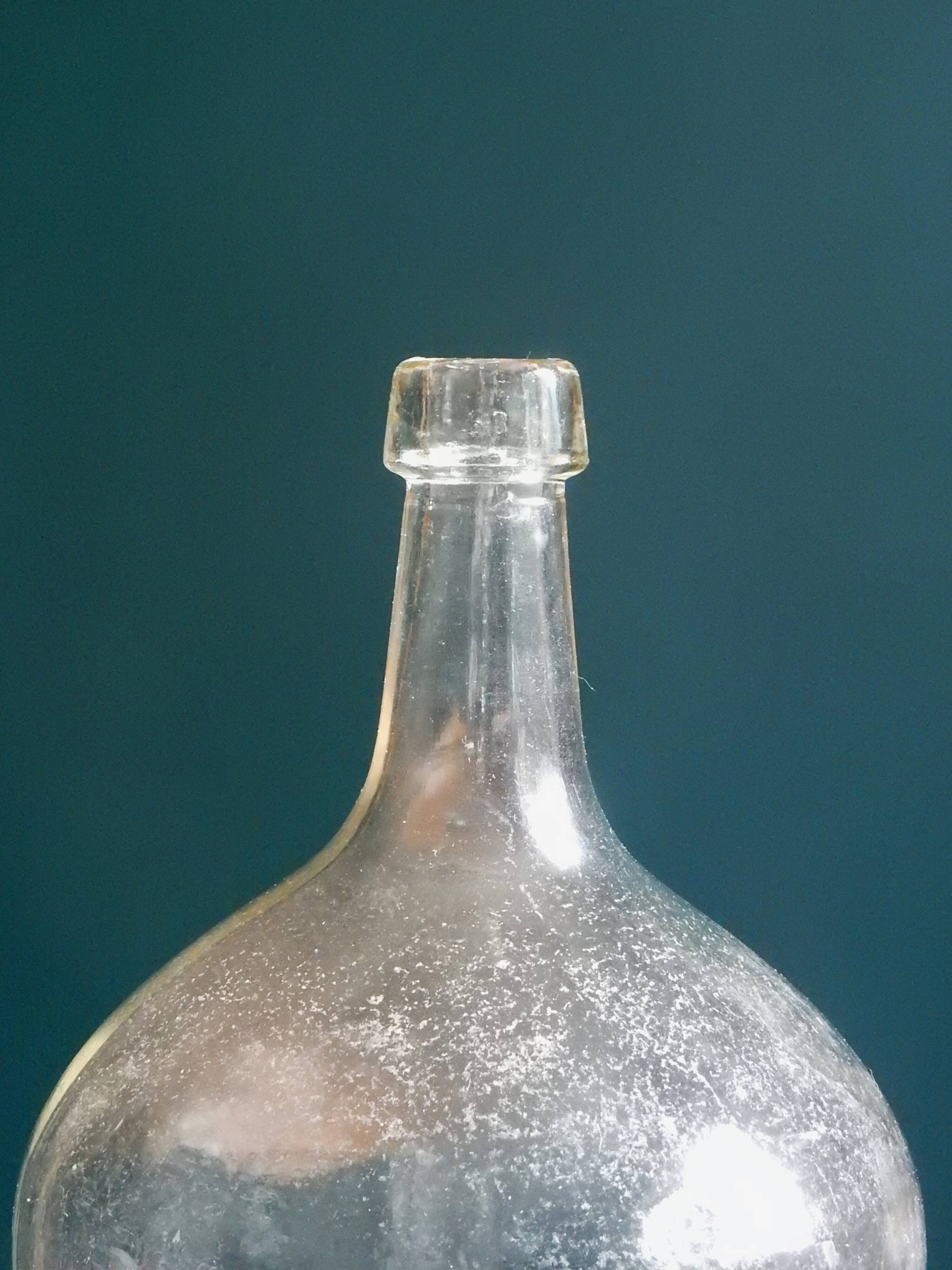 Demijohn in clear colorless glass