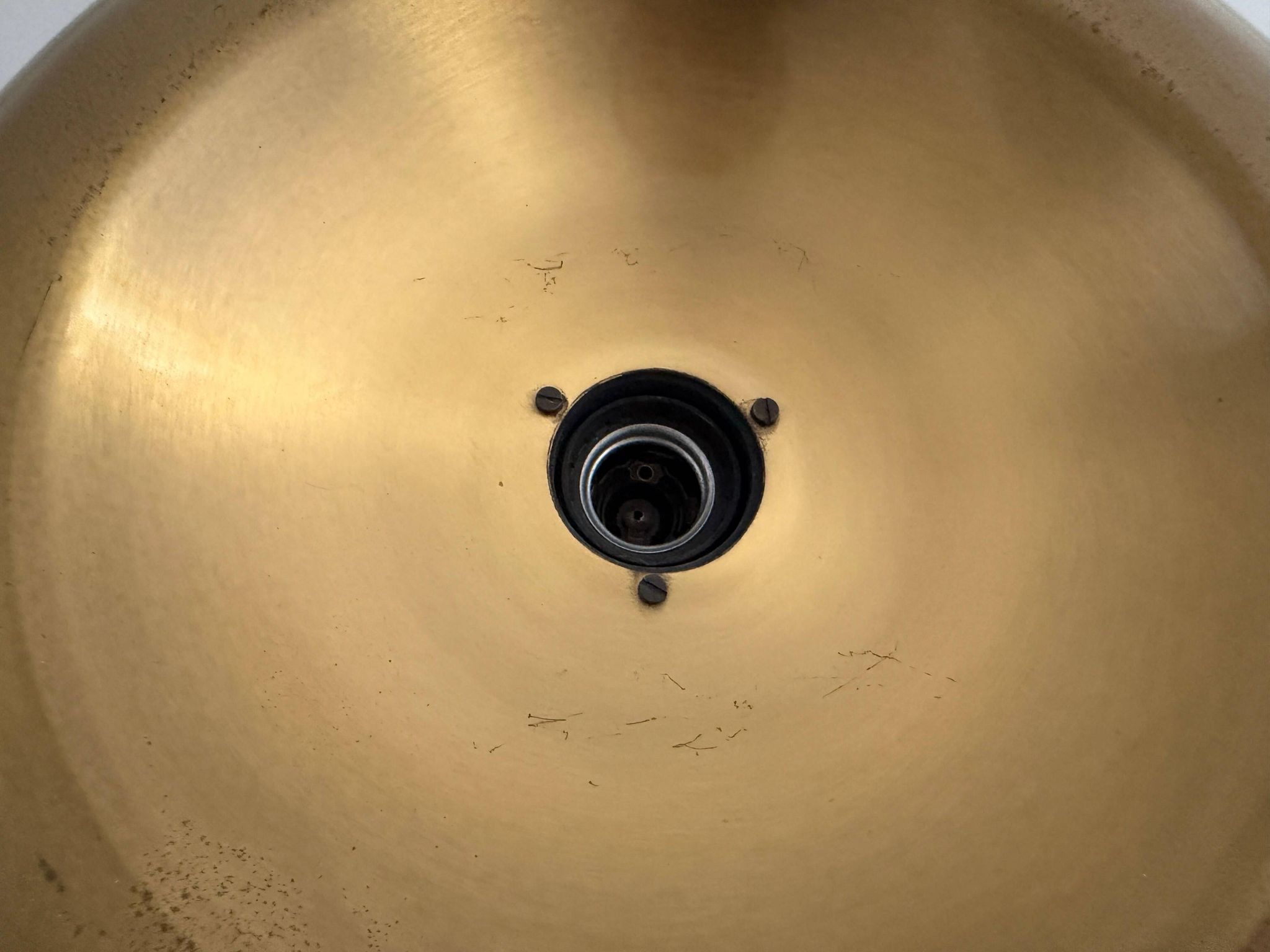 Flush-mounted disc-shaped brass fixture from the mid-century, 1960, Italy.