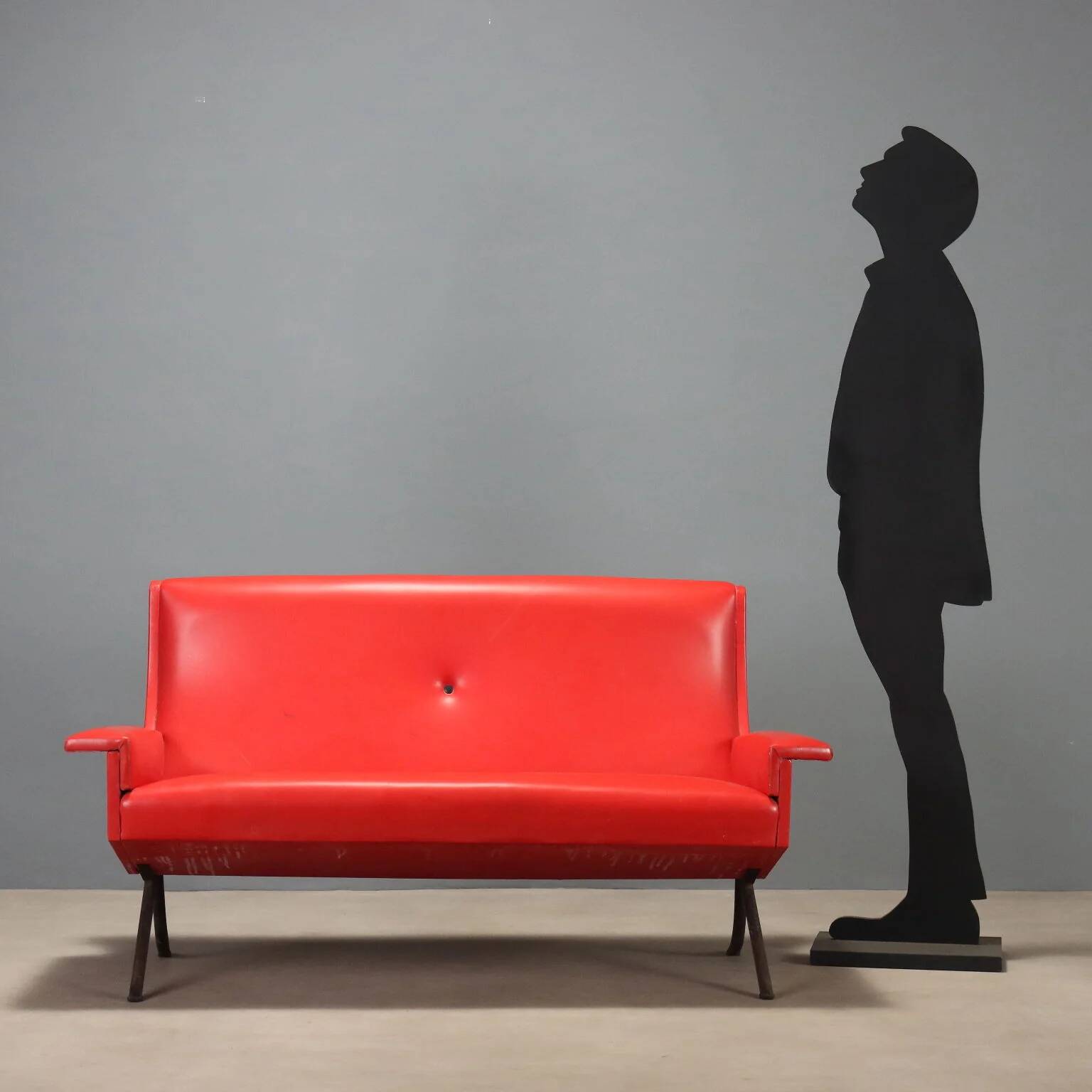Vintage red faux leather sofa from the 1960s.