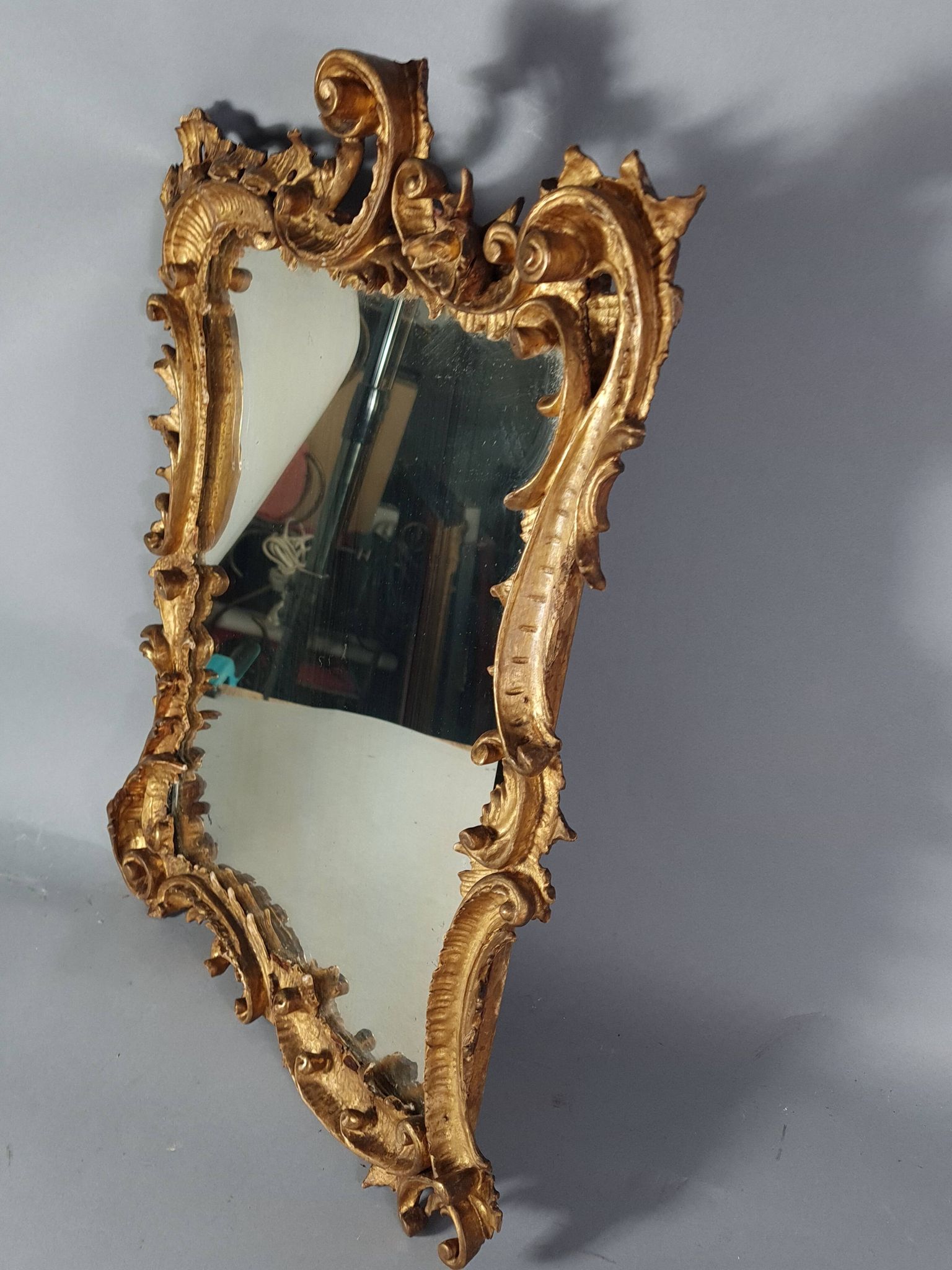 Mirror circa 1800, carved and gilded wooden frame, rocaille decoration, 54x39 cm, C227