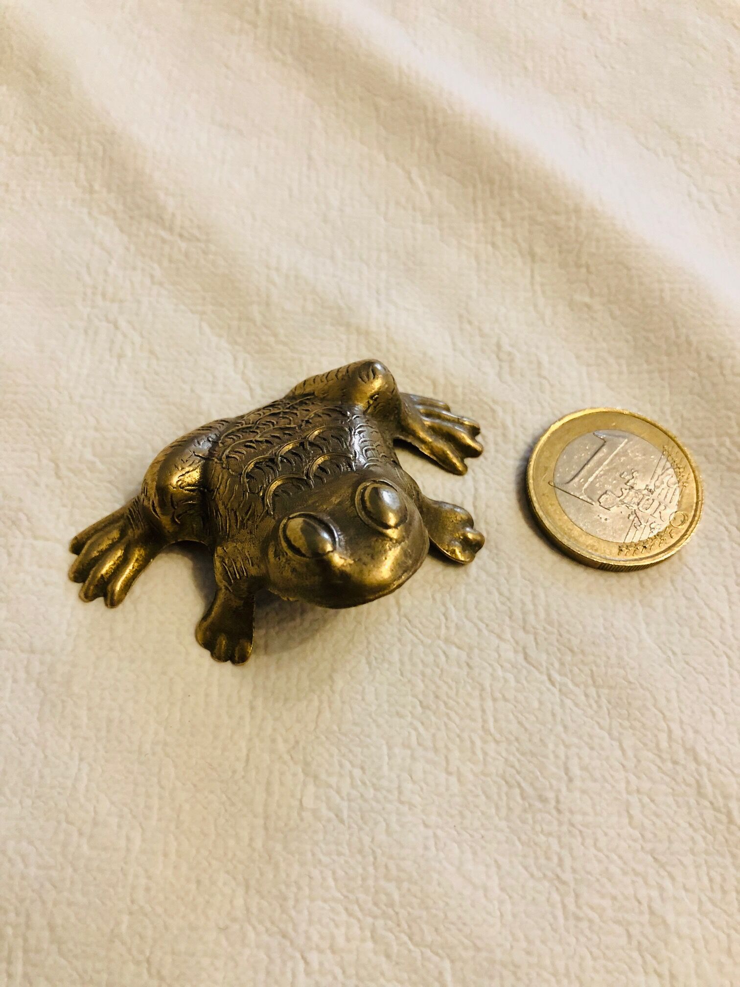 Small brass frog