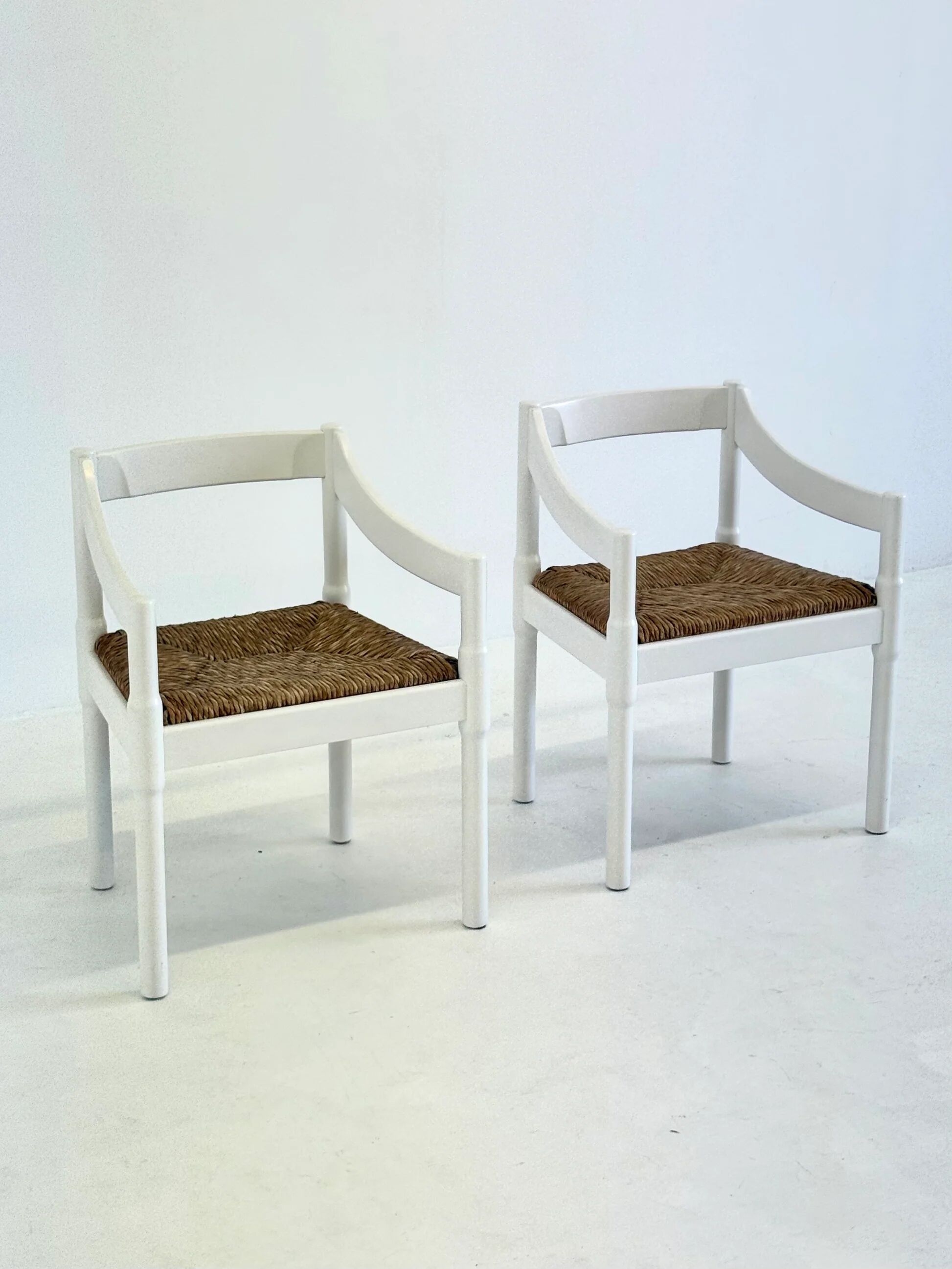 Set of two Carimate chairs by Vico Magistretti in white