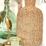 Glass bottle and braided rope