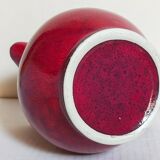 Vintage red enamel ceramic pitcher