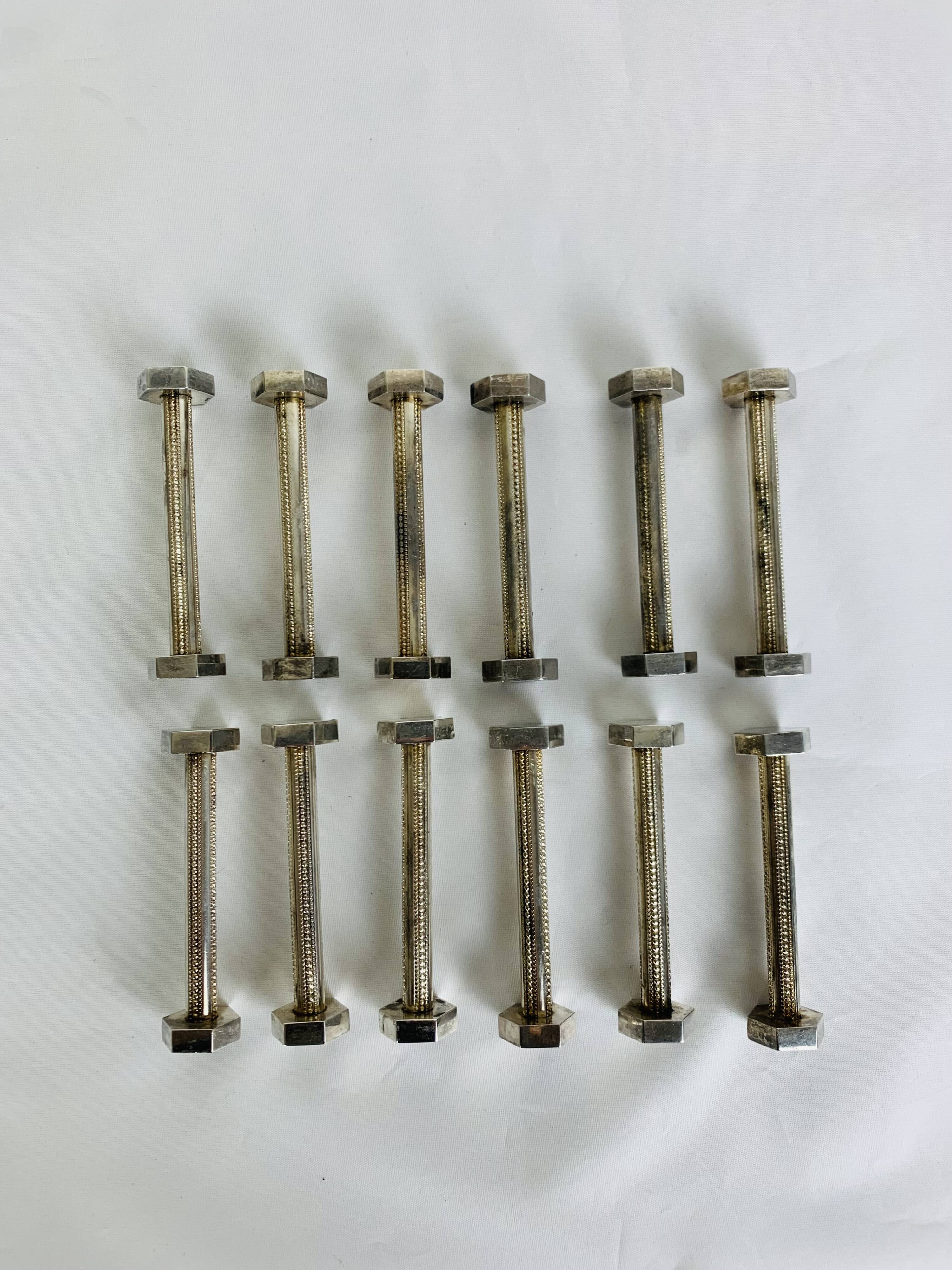 12 art deco silver metal knife holders
