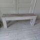 Bench, bed end on pearl grey patinated wheels, powder white, bleached wood seat