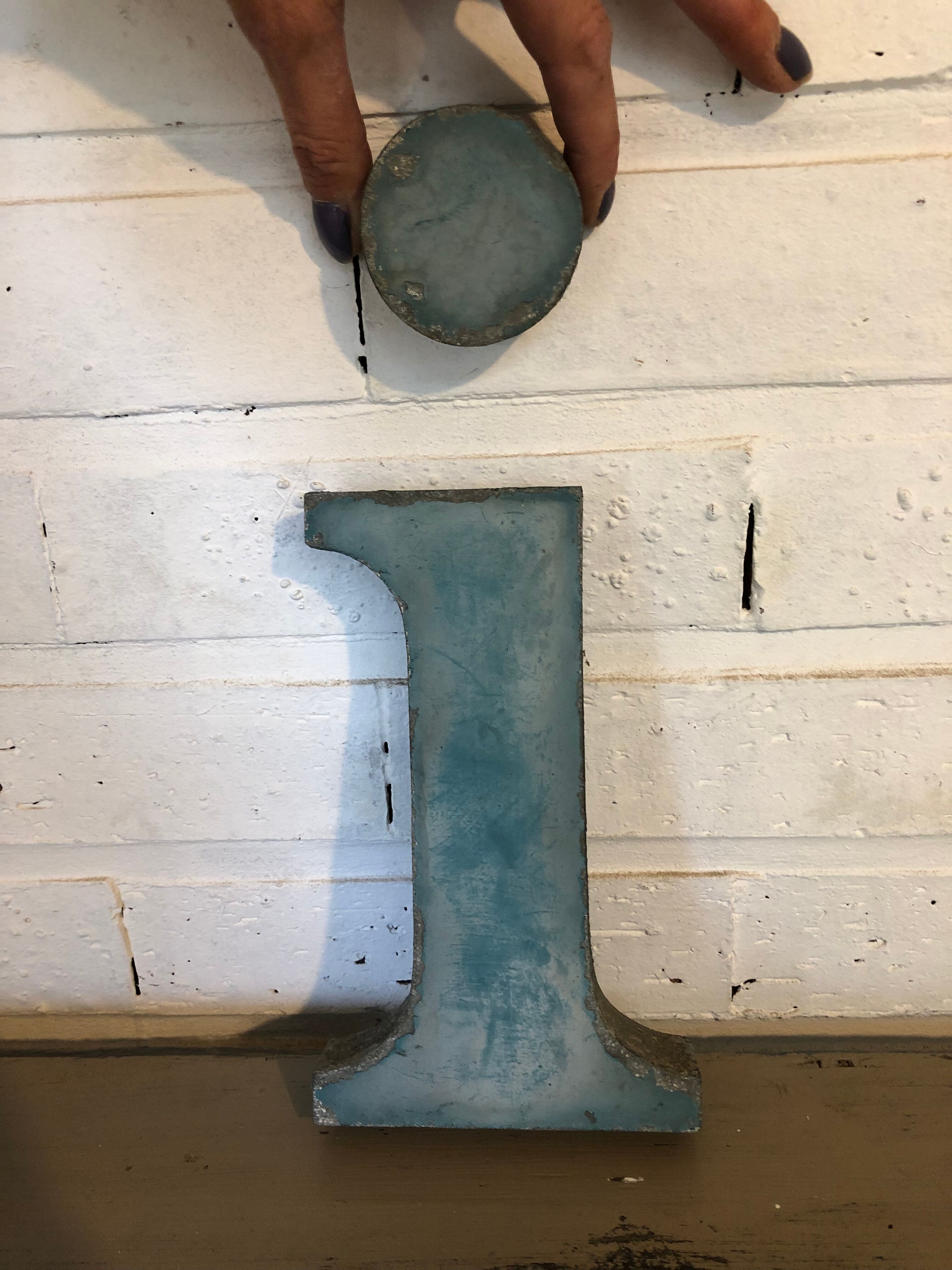 Blue sign letter "i"