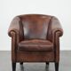 Great luxurious brown cowhide club armchair with matching piping