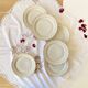 Set of 6 antique off-white porcelain dessert plates with gold trim
