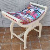 Curule stool in patinated carved wood, Manuel Canovas seat, 60 cm