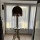 Living room floor lamp in bronze and white marble.