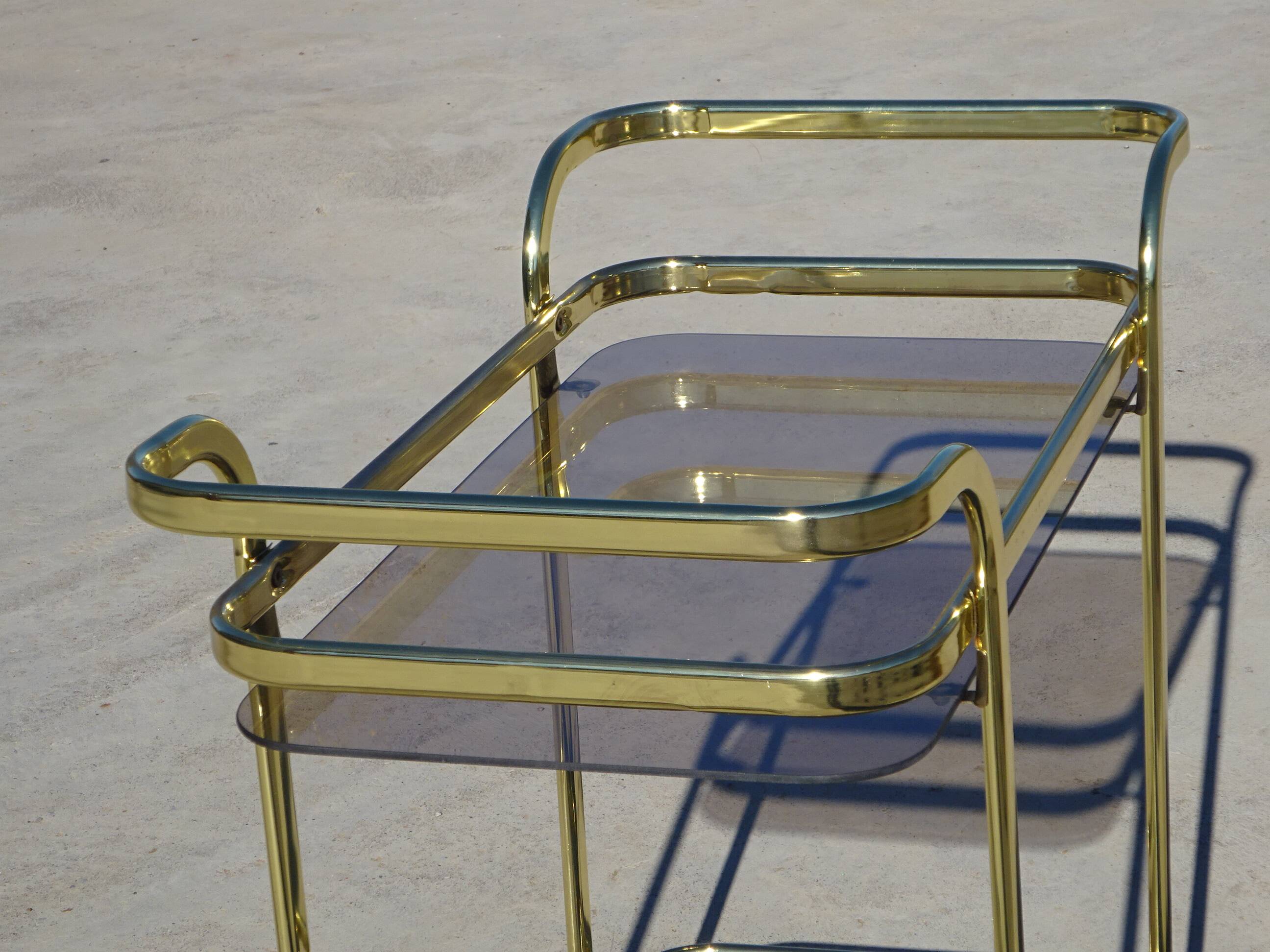 Golden metal and smoked glass dessert table