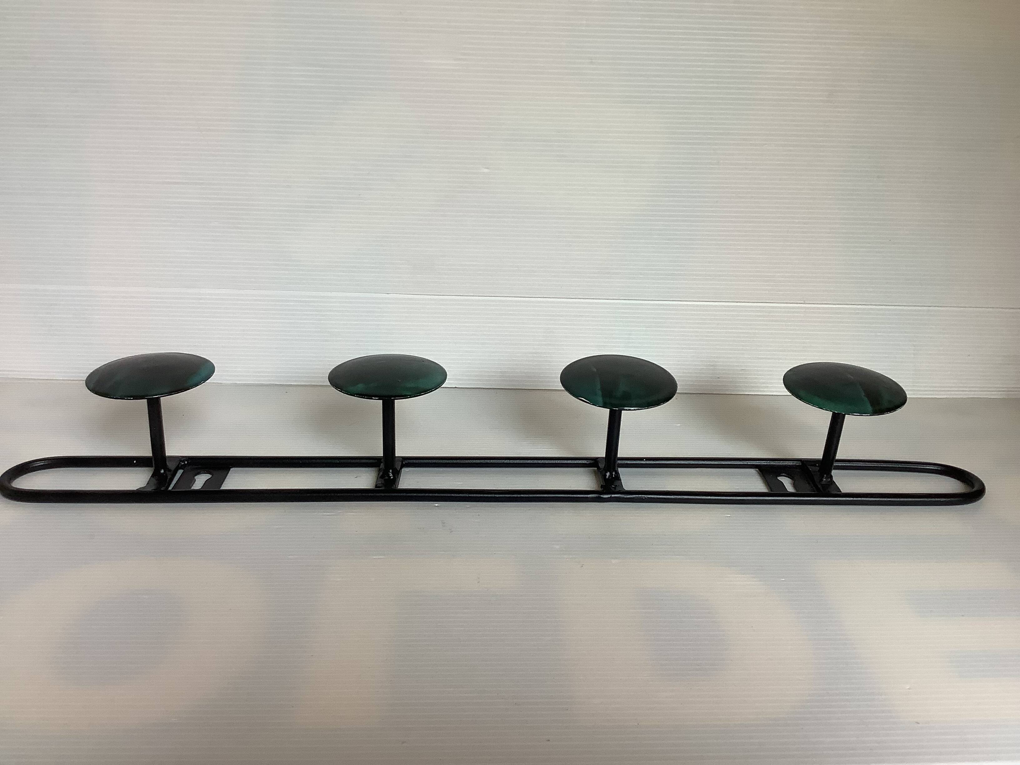 Green black metal coat rack with four hooks