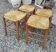 Set of four stools - oak and straw - c. 1950.