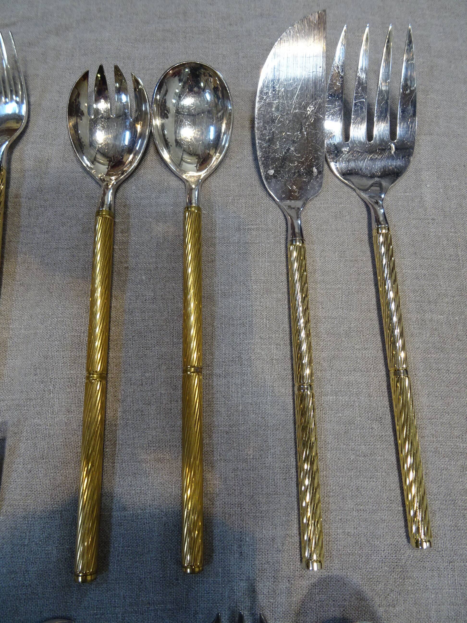 Housewife in silver and gold metal 104 cutlery