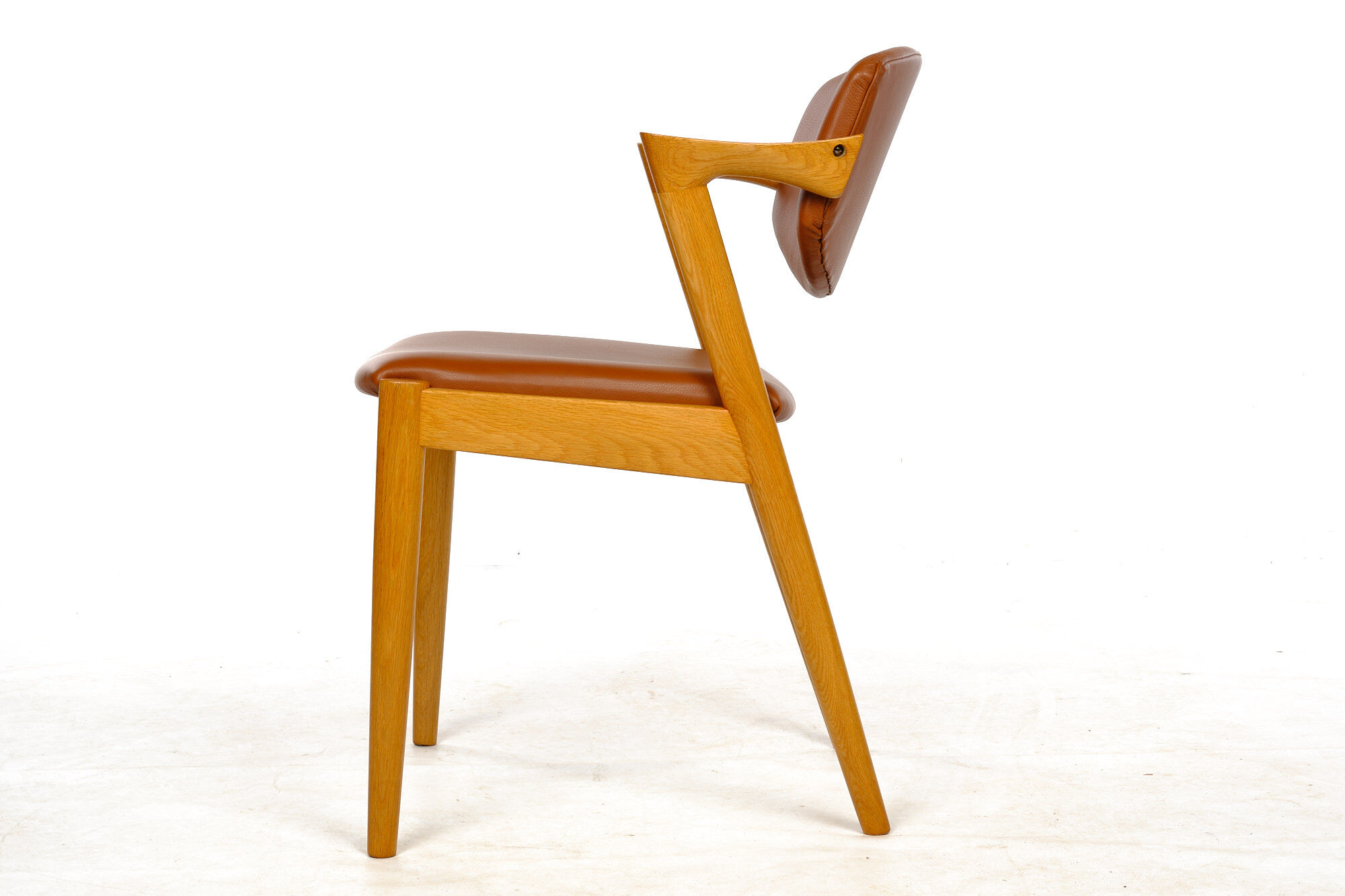 Four Kai Kristiansen oak chairs with new leather upholstery