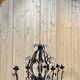Large pineapple chandelier in blackened metal and tassels