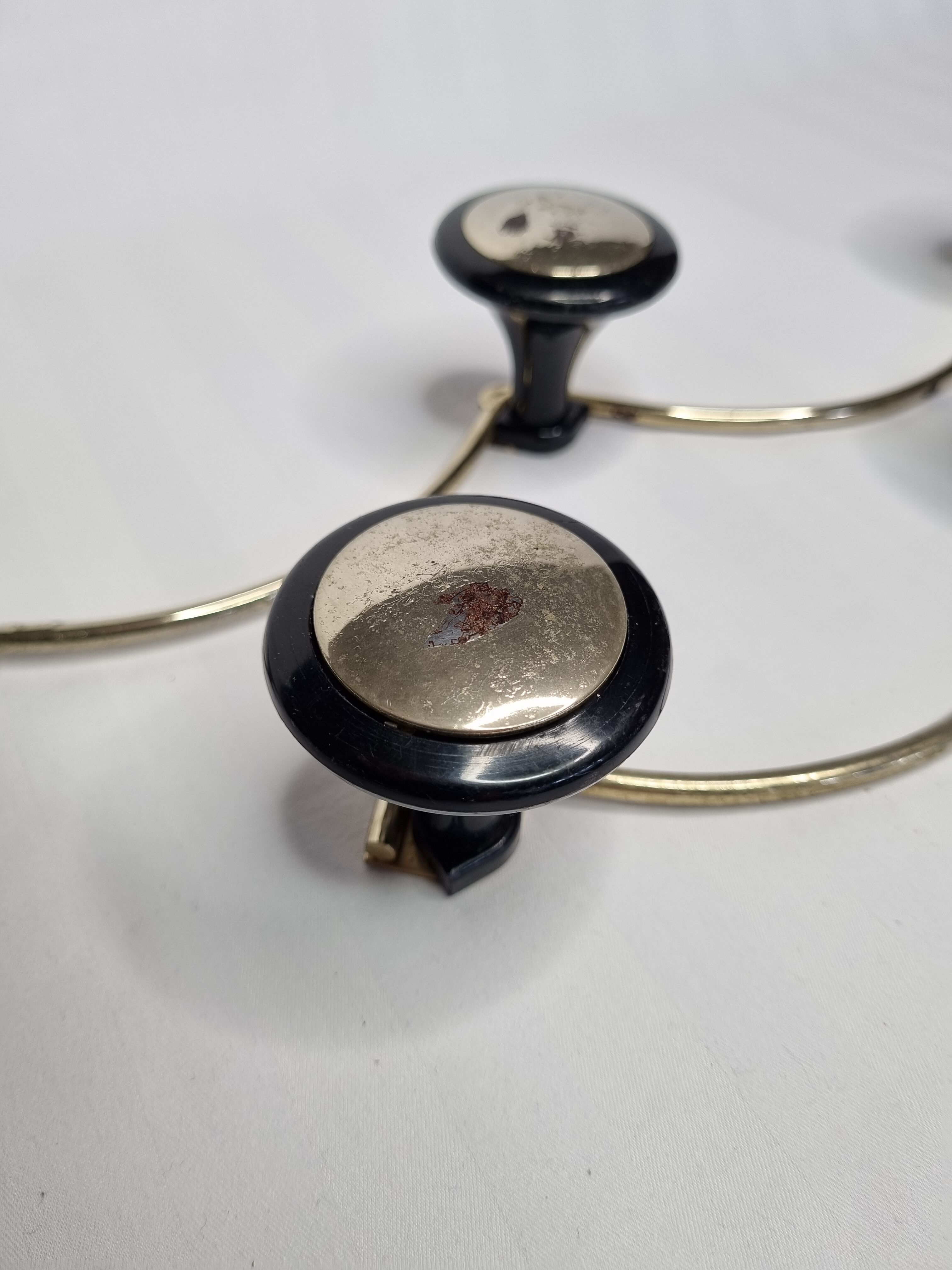 Pair of vintage wall coat racks in gold metal