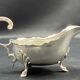English George III style silver plated tripod sauce boat