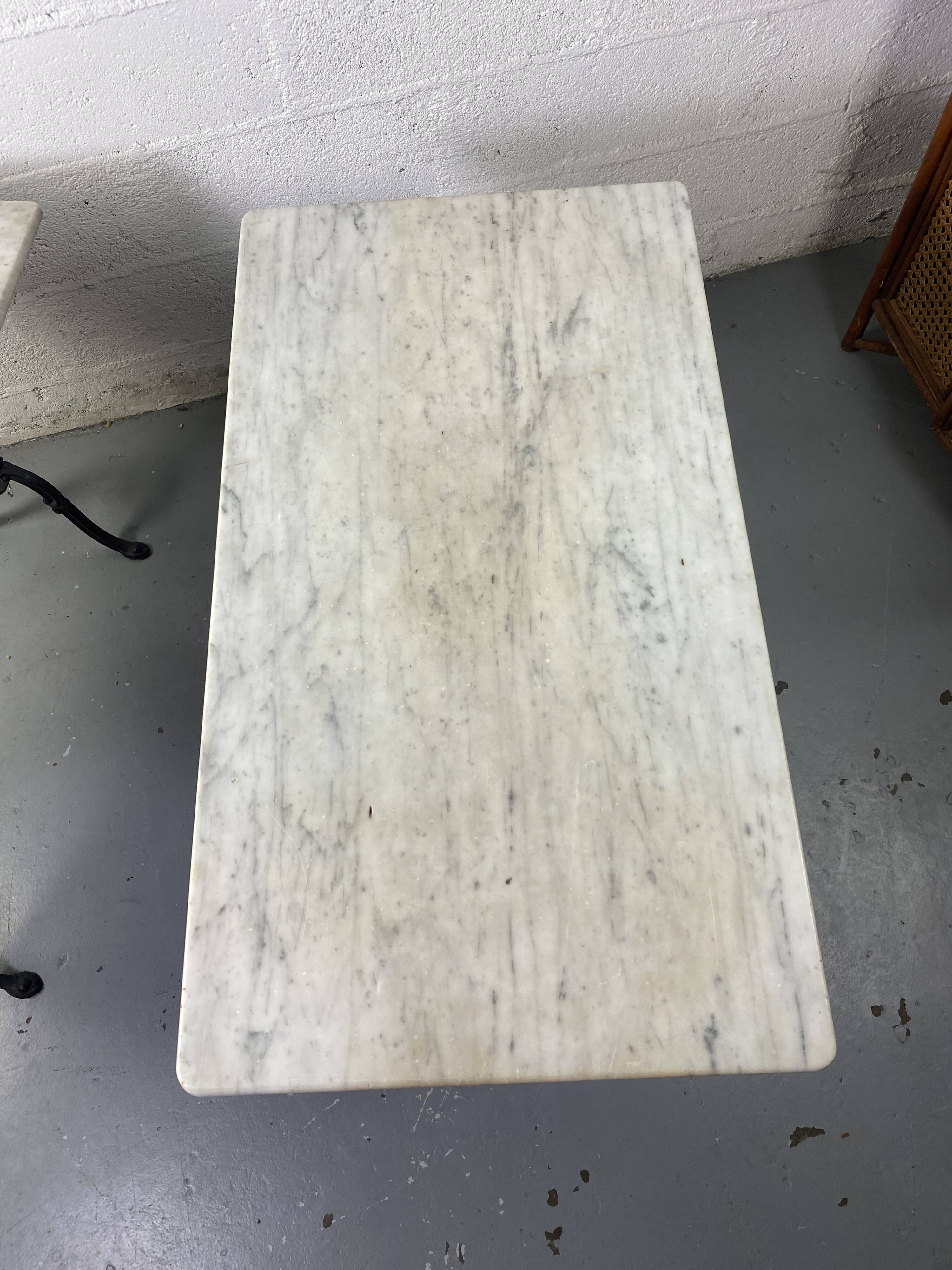 Set of two bistro tables in marble and wrought iron