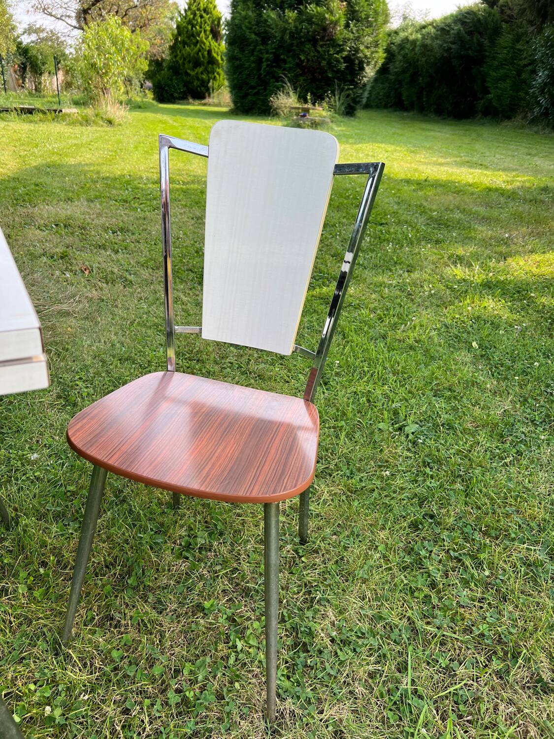 White Formica table with extensions and 2 designer chairs