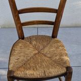 4 mismatched wood and straw chairs