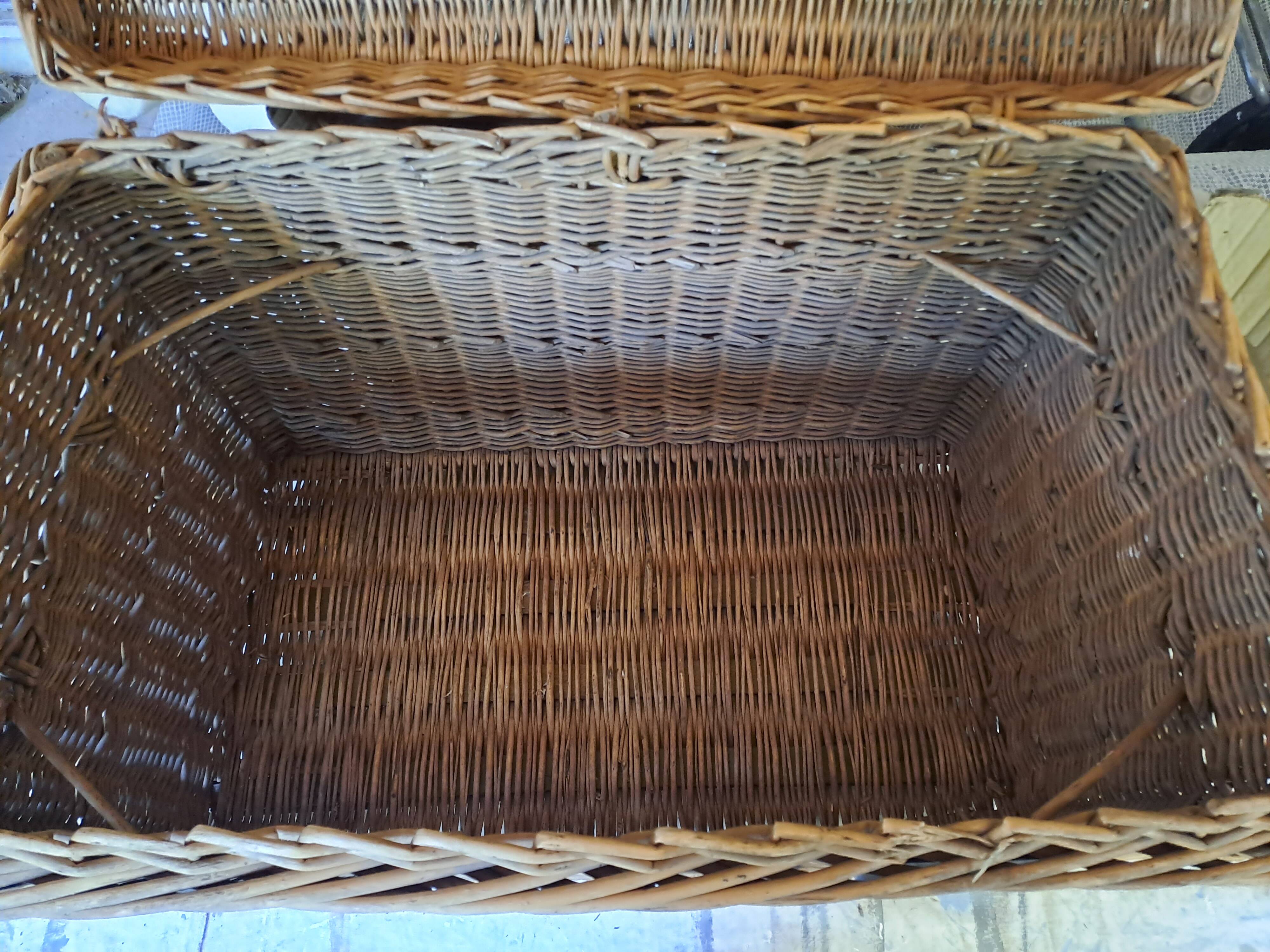 Wicker travel trunk XIX with metal clasps and handles.