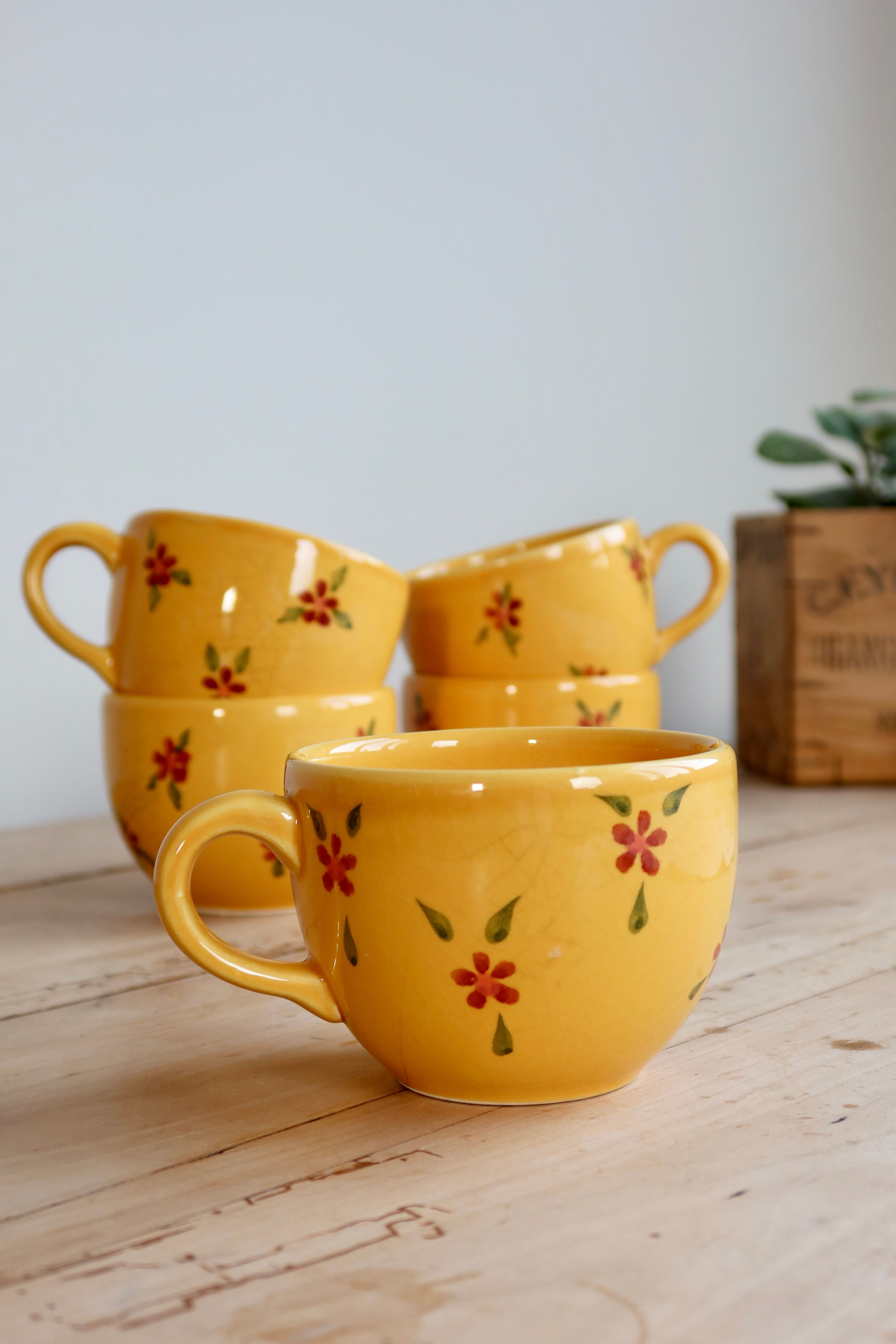 Large vintage ceramic mug in yellow with hand-painted flowers.