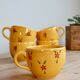 Large vintage ceramic mug in yellow with hand-painted flowers.