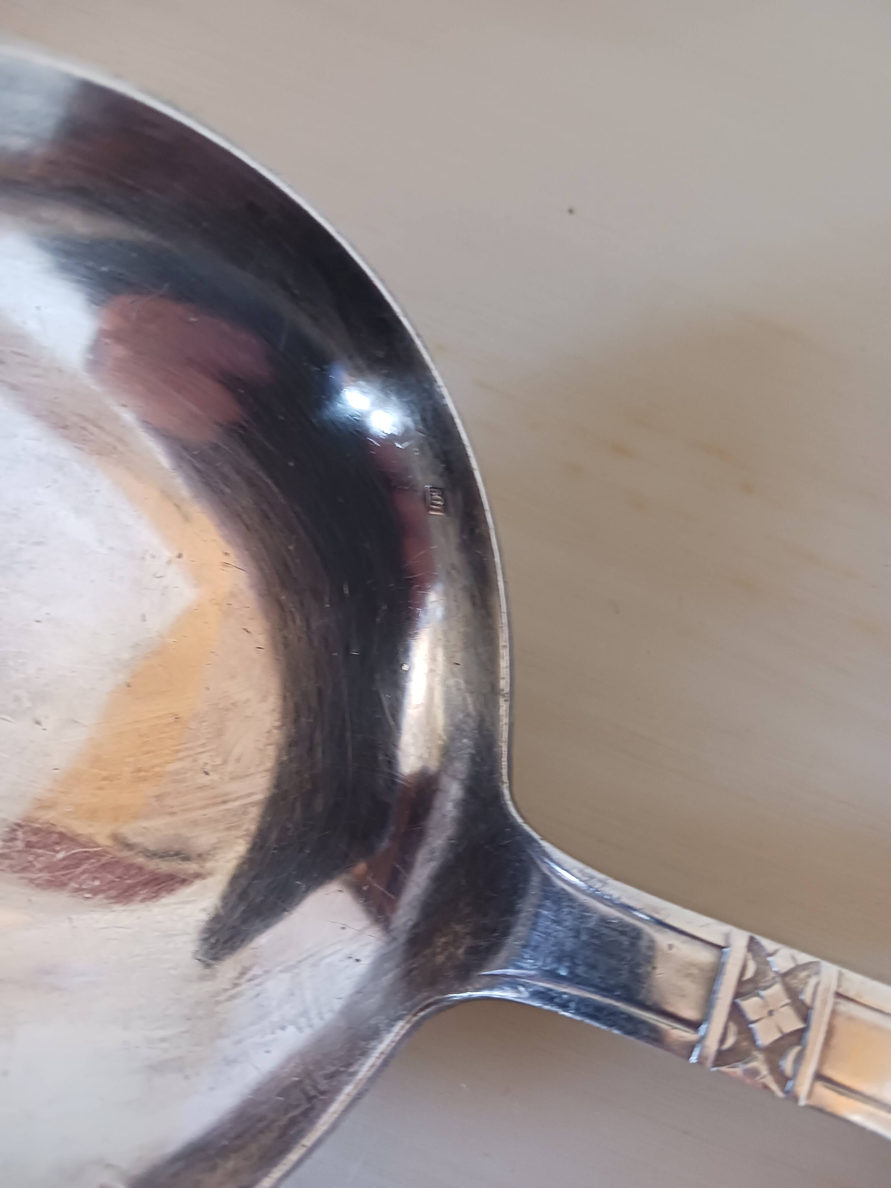 Silver-plated metal ladle, art deco motif.
