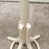 Parrot wears white Baumann coat 1970