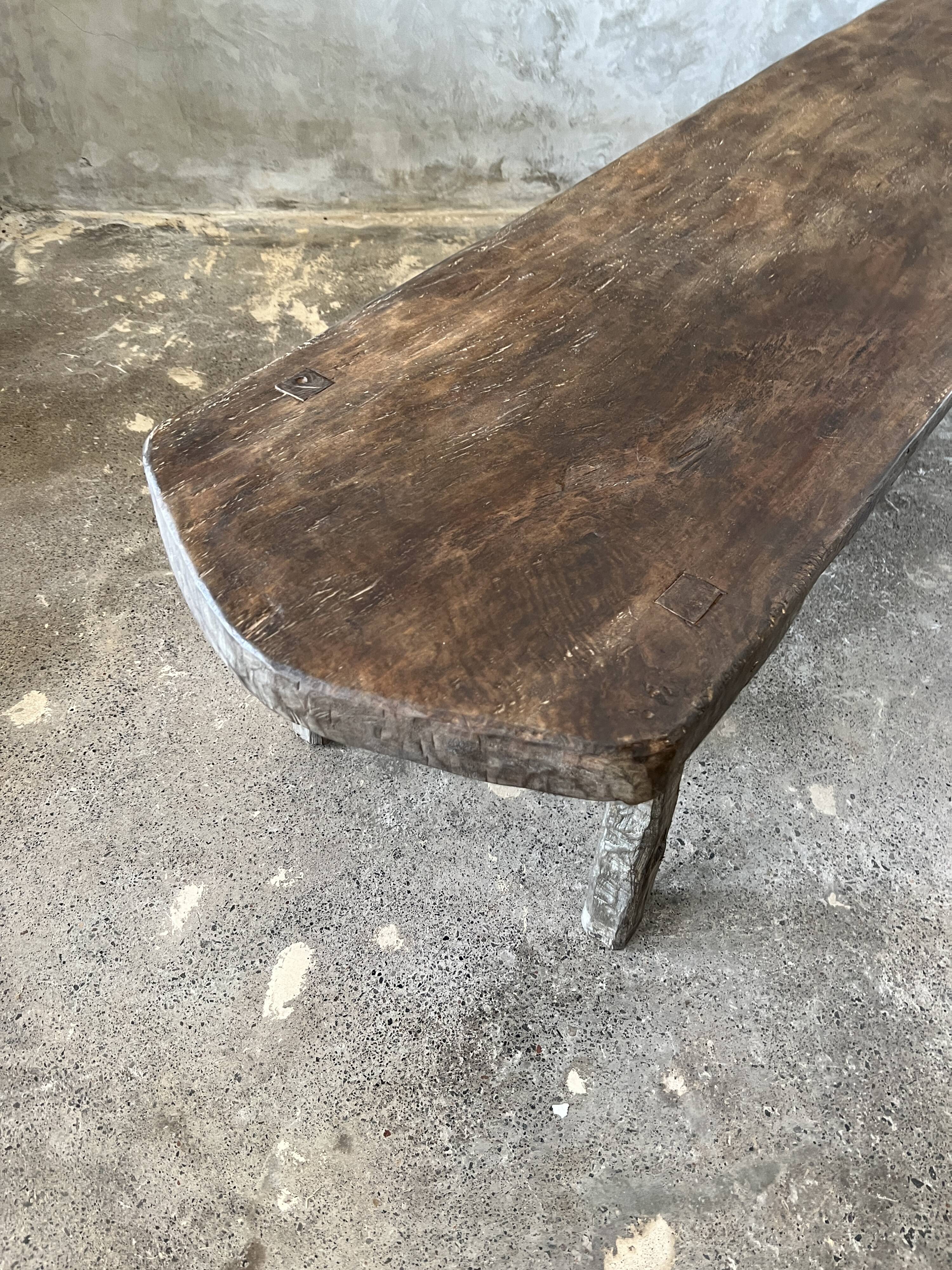 Large rounded coffee table in old Asian teak