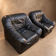 Leather armchairs and matching pouf, Italy, circa 1980
