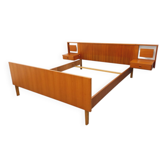 Vintage Scandinavian style double bed in teak from the 60s with integrated bedside lights