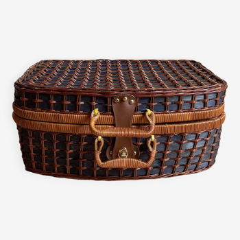 Blue wicker suitcase