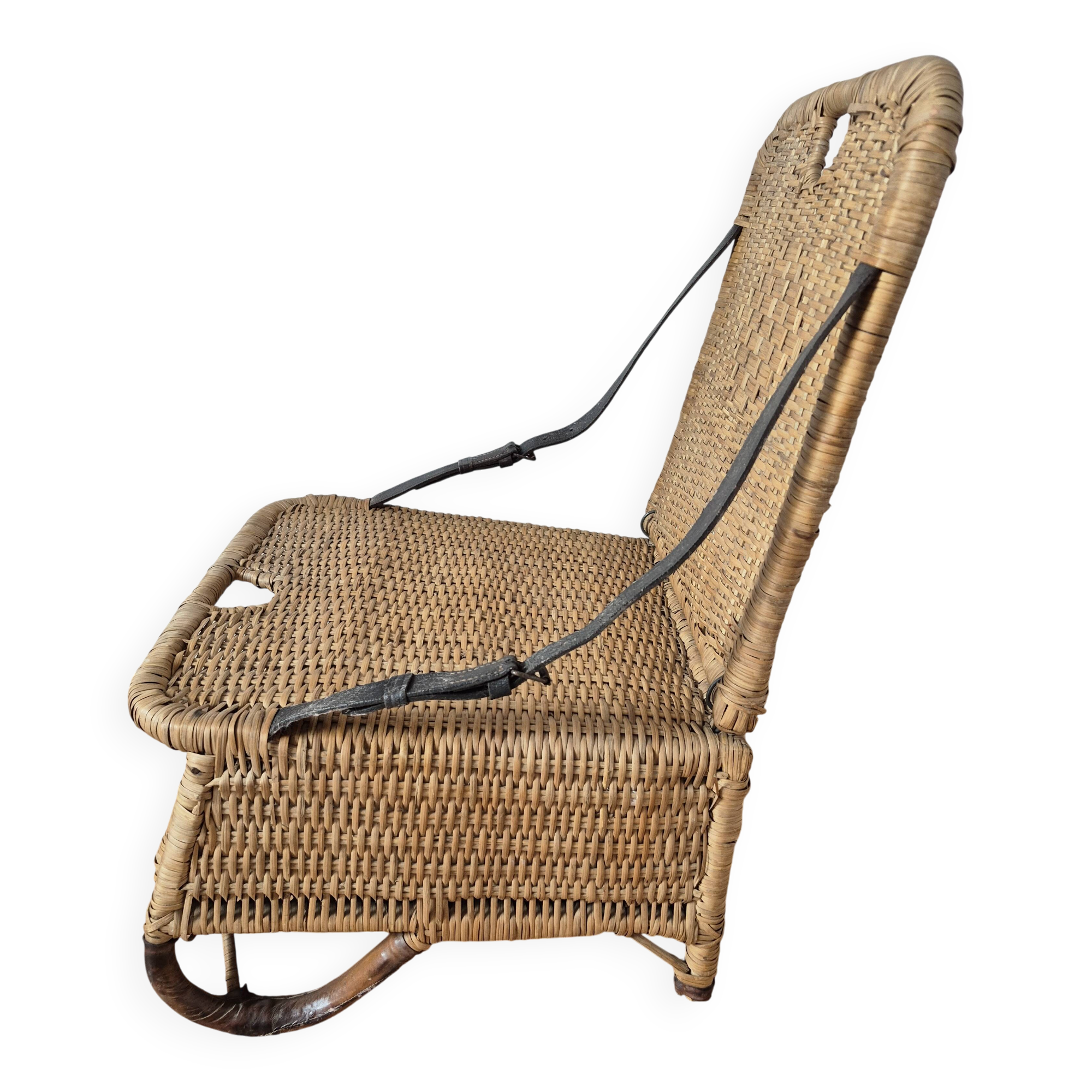 Vintage foldable beach chair, picnic in rattan and leather.
