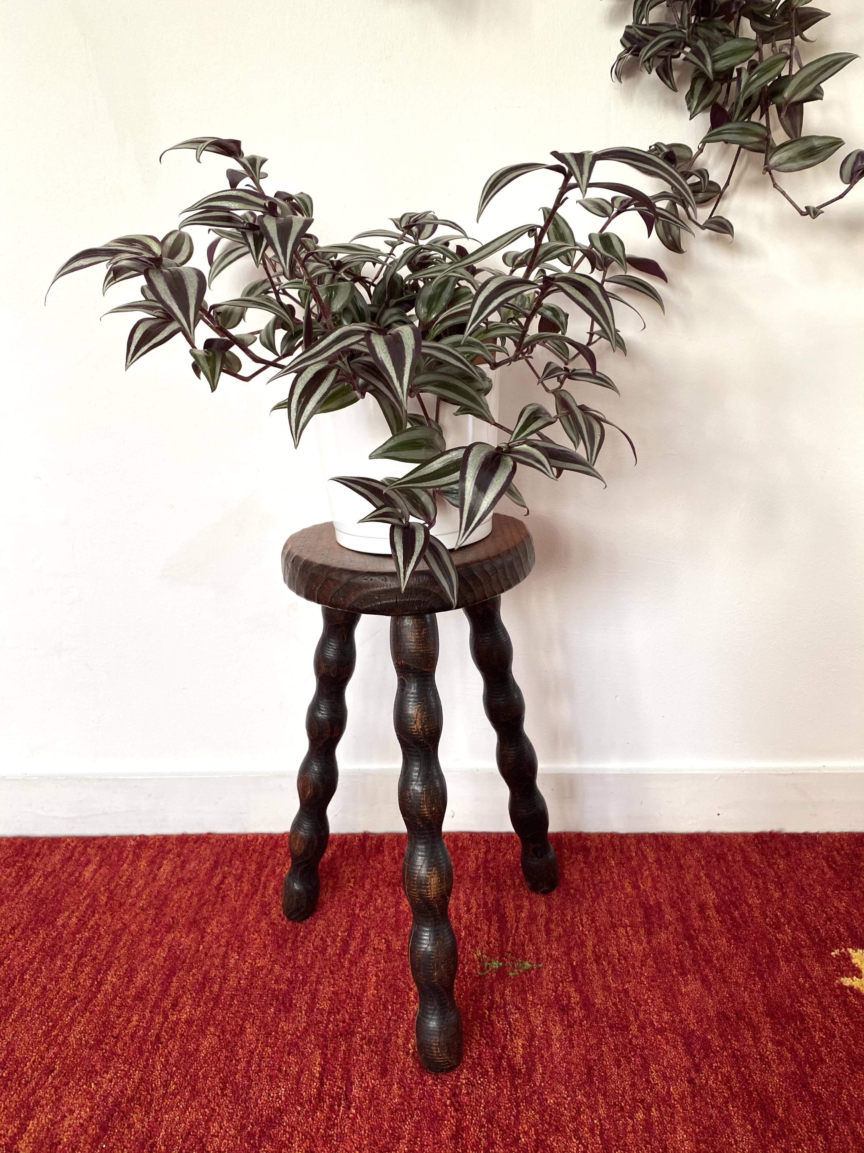 Old tripod stool in solid wood