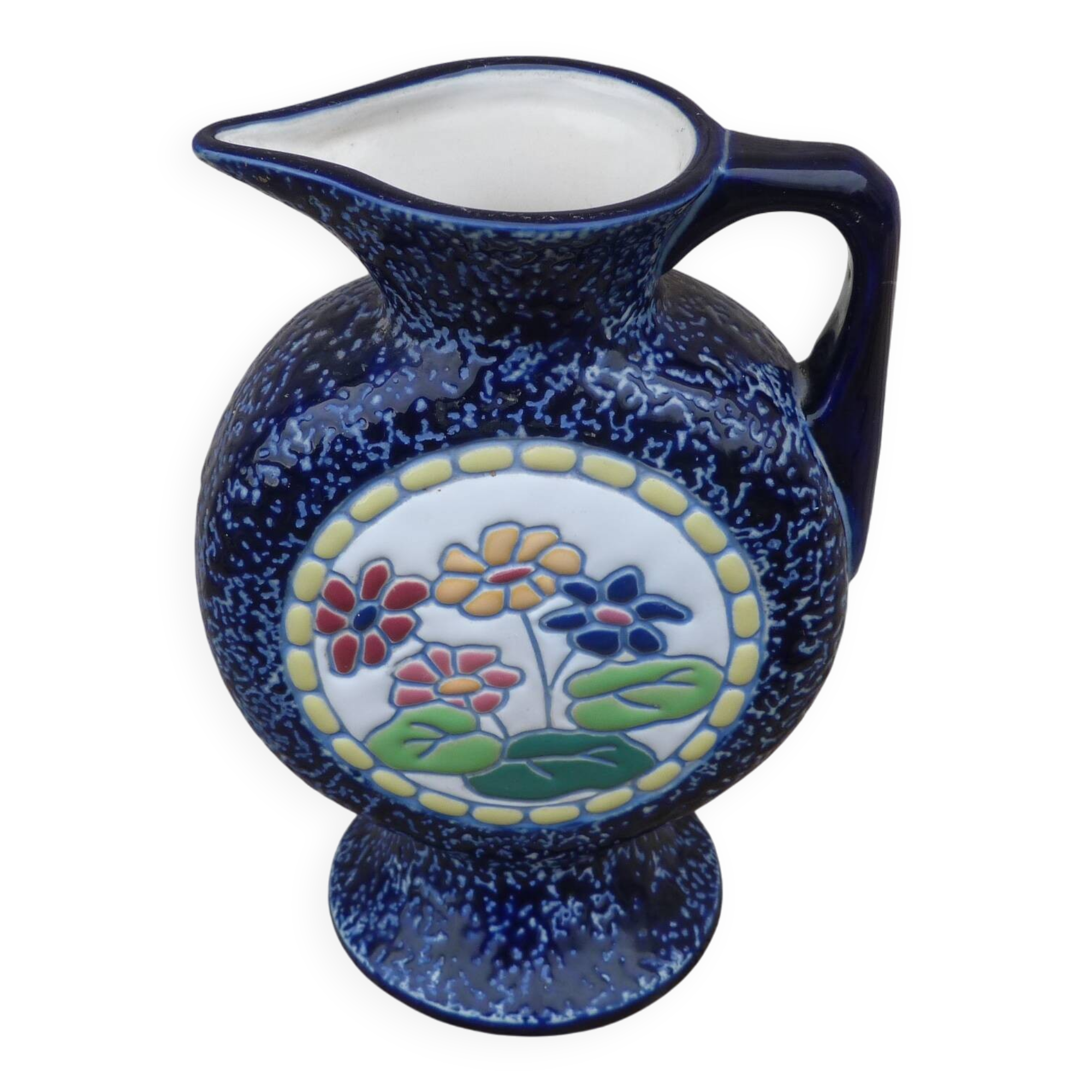 Blue ceramic vase with floral motifs