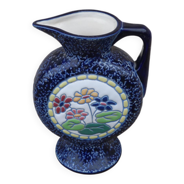 Blue ceramic vase with floral motifs