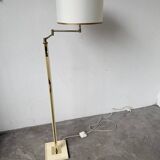 Floor lamp with articulated arm in brass-plated metal