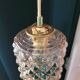 Moulded glass lamp with a cubic-spherical relief design.