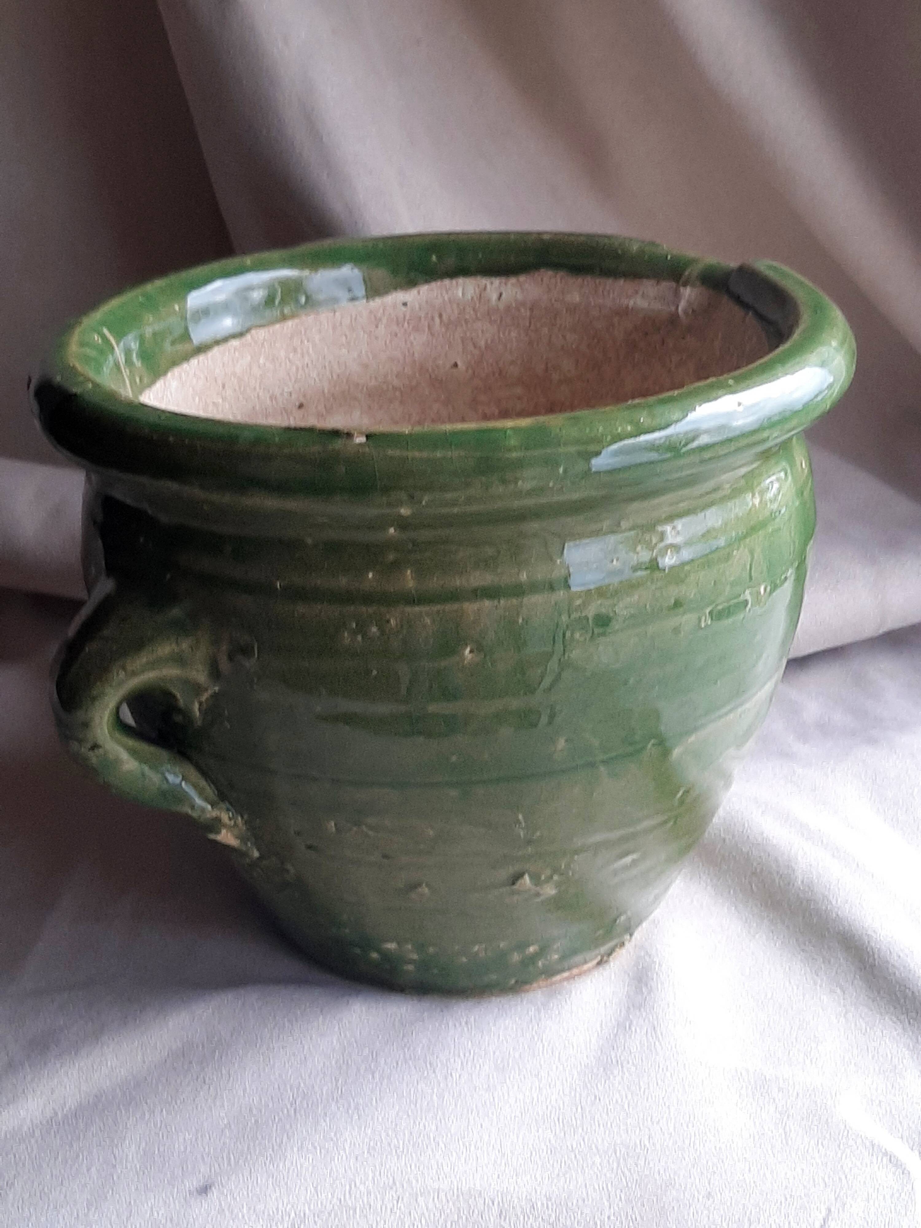 Glazed green terracotta pot.