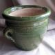 Glazed green terracotta pot.