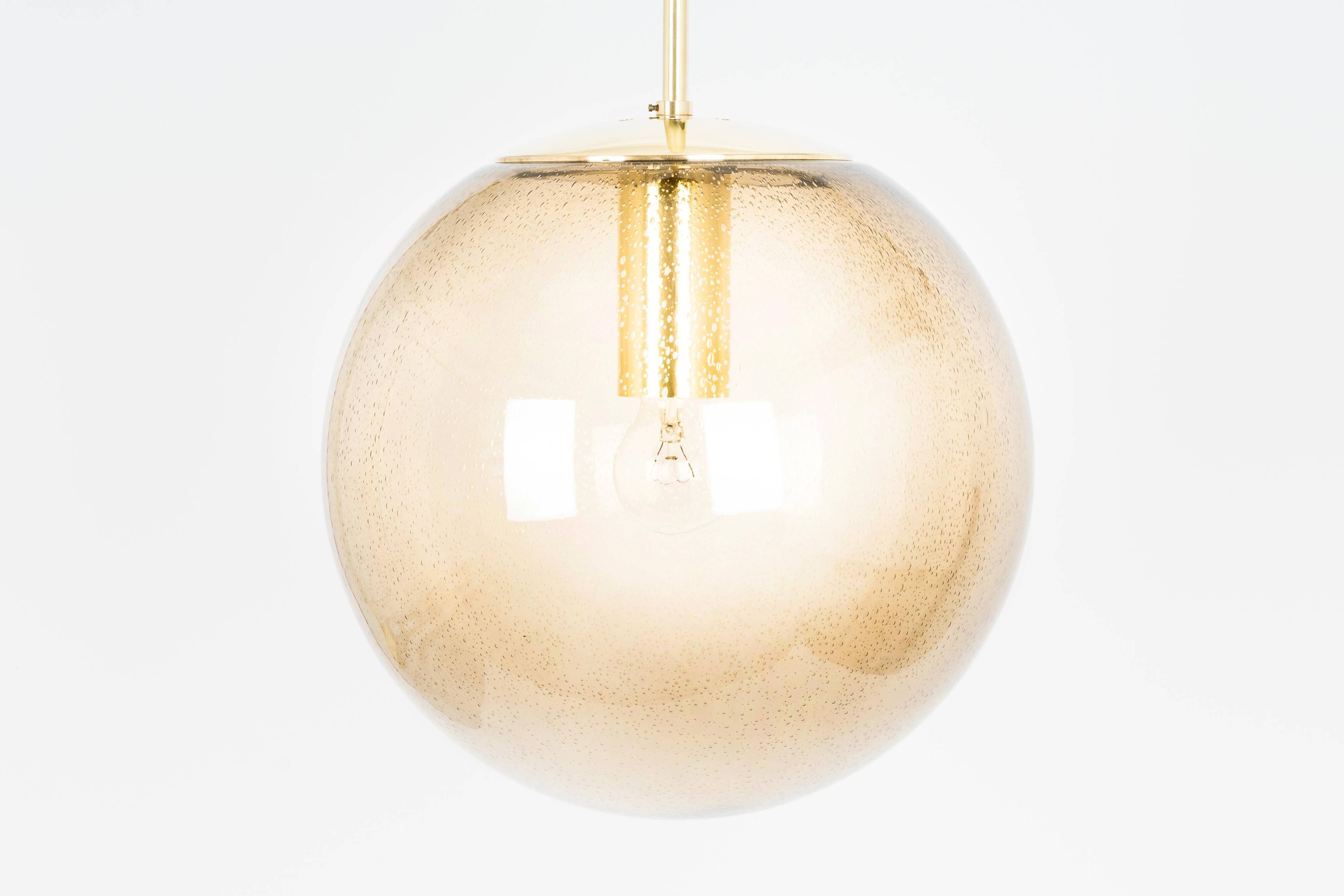 Smoked glass and brass ball pendant light Limburg, Germany, 1970s