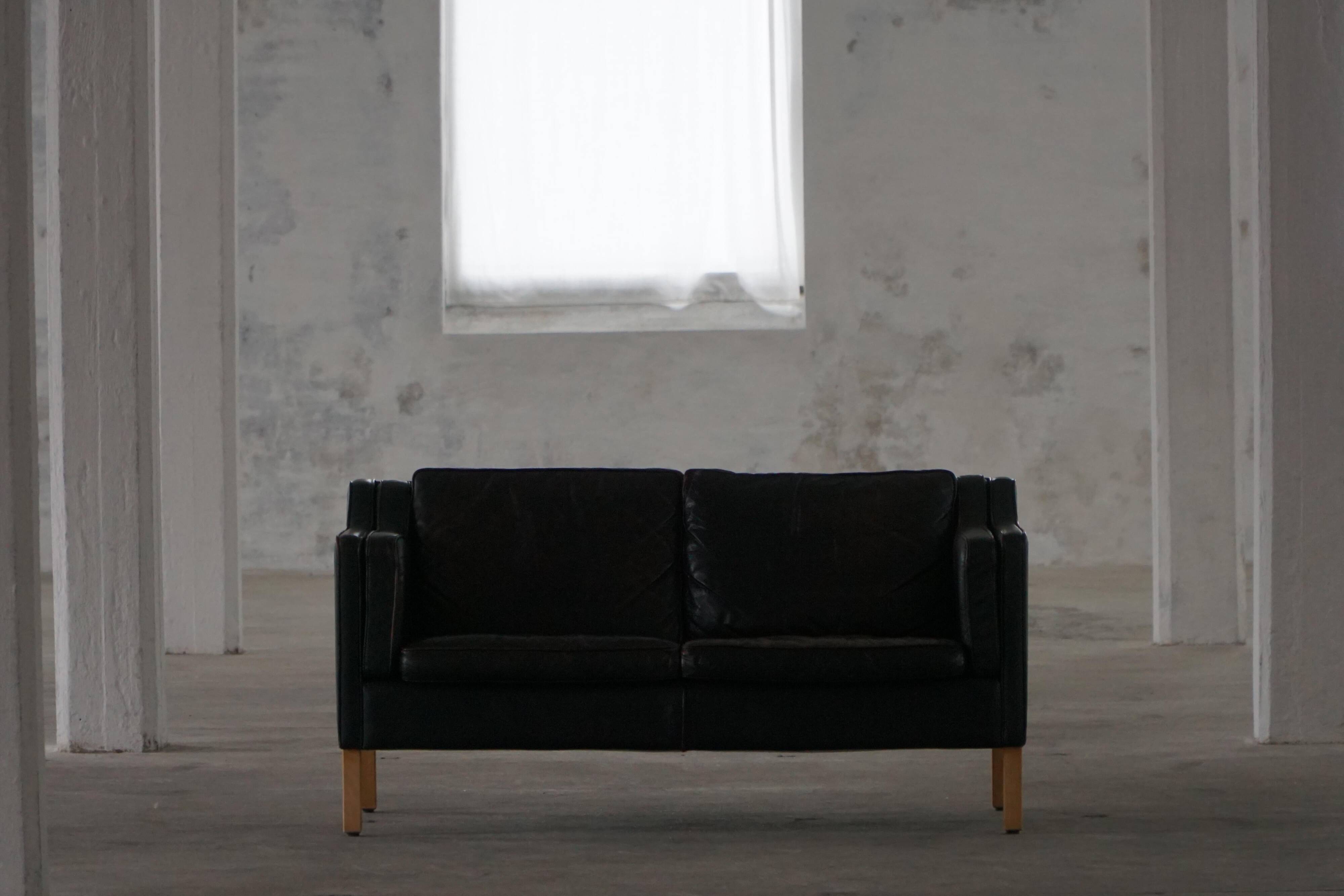Mogens Hansen, 2-seater canapé mid-century, patinated black leather, 1970s.